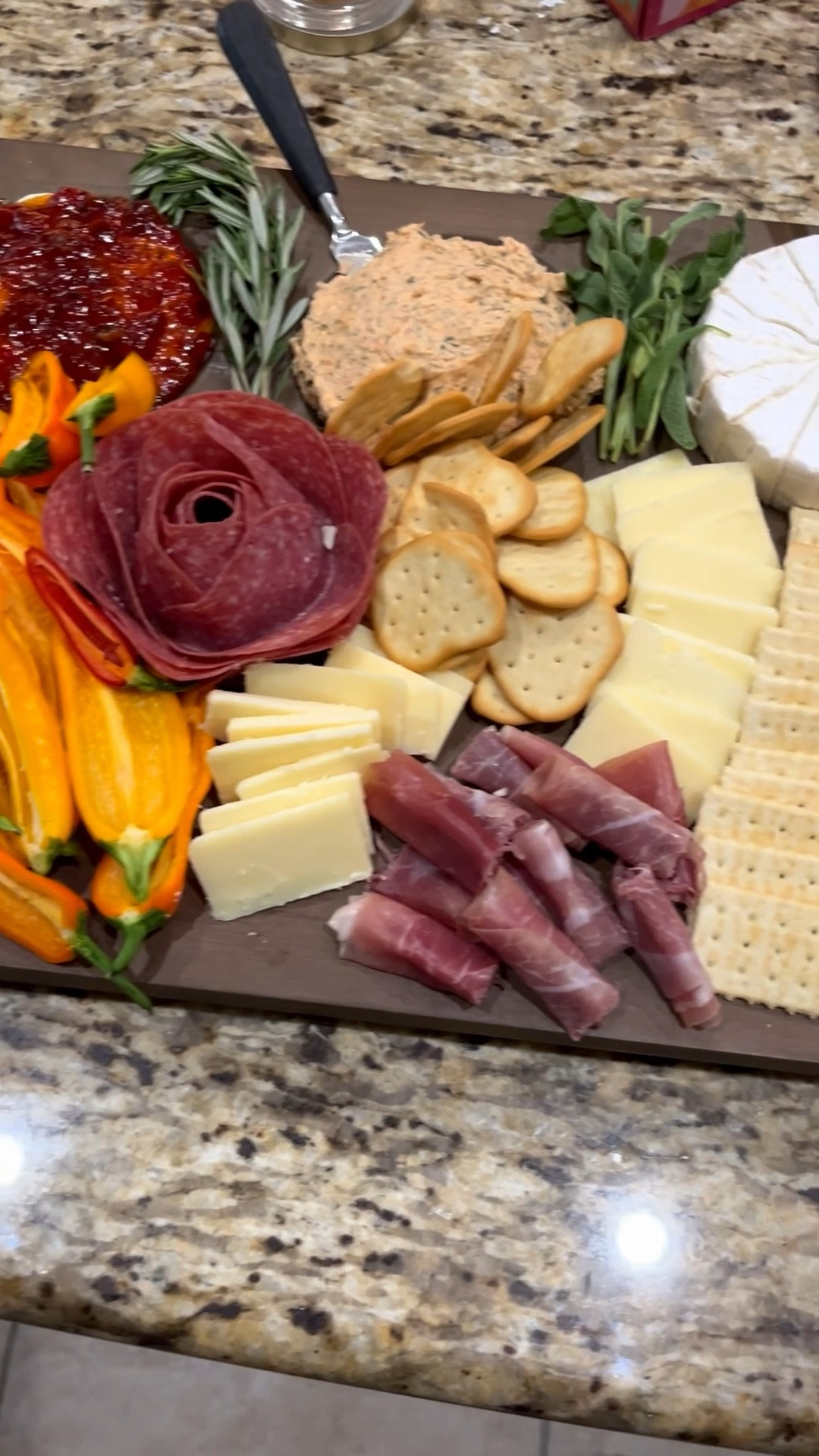 My lovely friend hosted Friendsgiving so I made a charcuterie board with my amazing Crate & Barrel board that I am so glad I bought. 💯 % worth it if you entertain at home or elsewhere.

I had whipped cream cheese and hot bacon pepper jelly, smoked salmon dip, brie, and honey fig jam. Also, sweet peppers, hard salami, club crackers, white cheddar, naan crisps, prosciutto, praline pecans, and green apple.i used fresh rosemary and sage to add some greenery.

#LTKHome #LTKParties #LTKfoodie