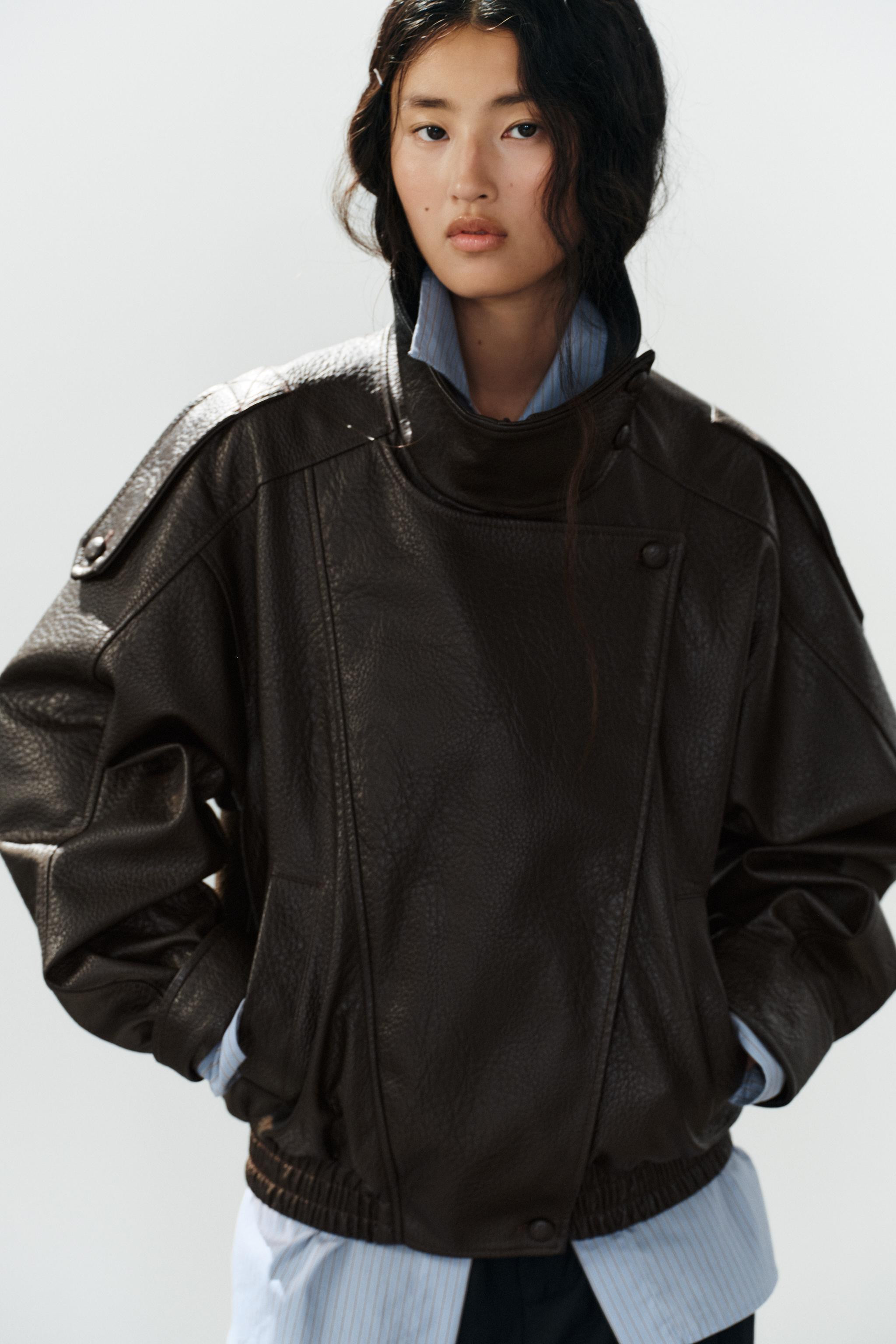 Faux leather jacket with a high collar. Long sleeves with cuffs and shoulder tabs. Side pockets. ... | Zara Canada