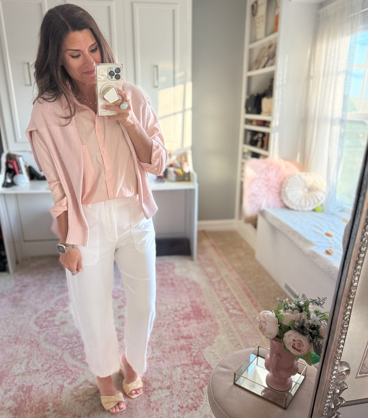 Country club chic look with pink button down shirt and cardigan and white barrel leg jeans/pants 

 