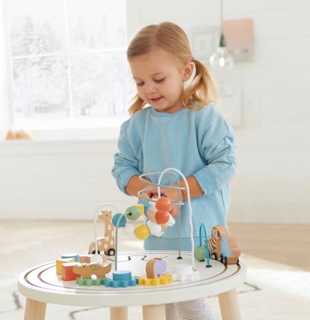With beads that slide, gears that turn, blocks that stack and animals that roll, this table will engaged your little one in learning, discovery and fun. And as they stand, reach and lean, they’ll be building coordination and balance.
DETAILS THAT MATTER
Expertly crafted from solid hard wood, MDF and rubber wood.
Finished in child-safe, water-based paint.
Activity center includes counting beads, sorting blocks and animals to stimulate baby's imagination.
Benefits of play are: improves hand-eye coordination, fine motor skills and problem solving skills. 

#LTKbaby #LTKkids #LTKfamily