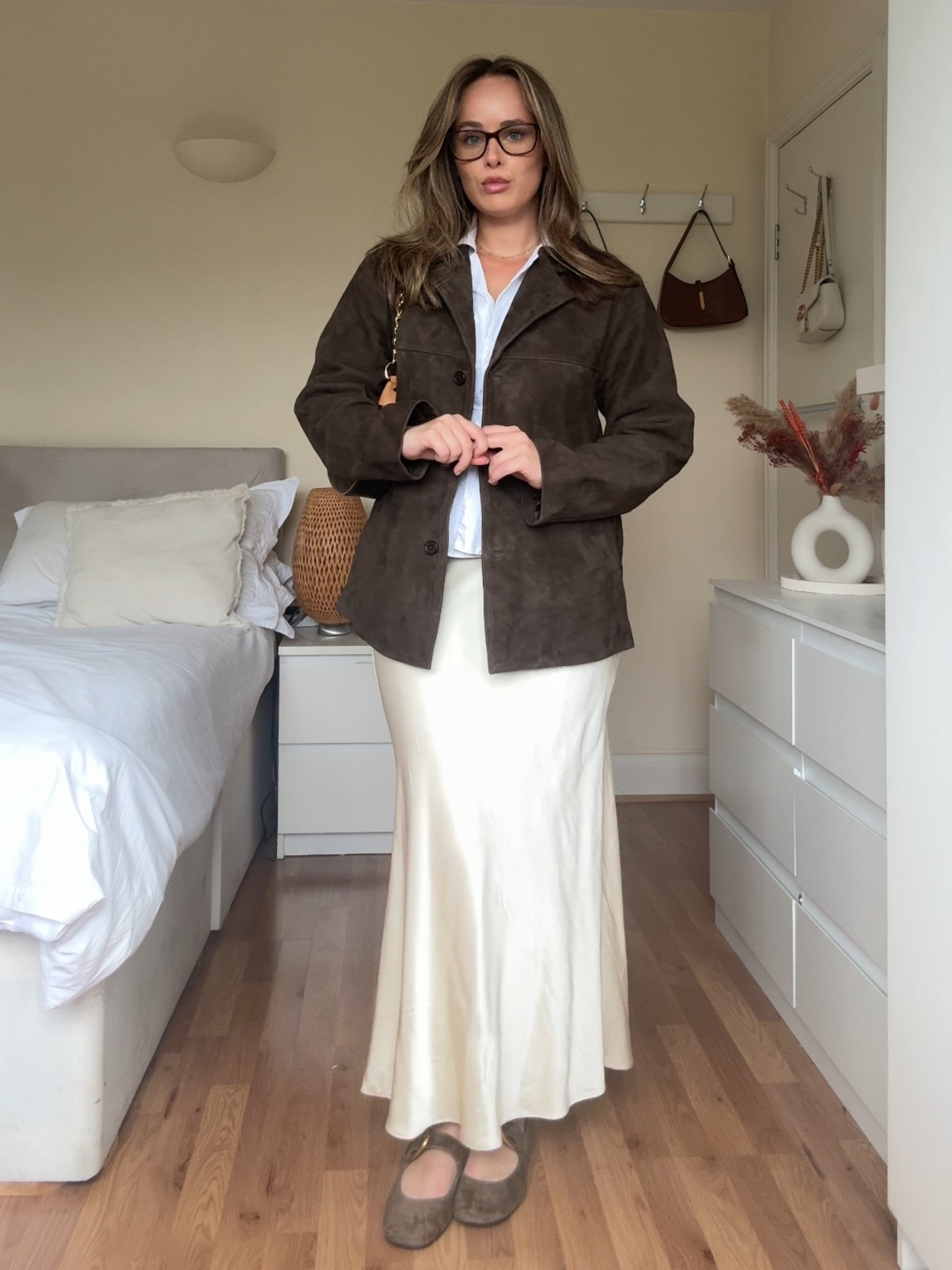 Effortless fall outfit idea 🍂 Styling a cream satin maxi skirt with a suede jacket, classic button-down shirt, and ballet flats for an elevated neutral look. This chic fall uniform is perfect for the office, coffee runs, or weekend plans. Linking my exact outfit + affordable neutral staples on LTK ✨ #LTKfashion #LTKstyle #falloutfitideas #satinmaxiskirt #neutrallooks #balletflats #fallcapsulewardrobe

#LTKuk #LTKautumn #LTKeurope