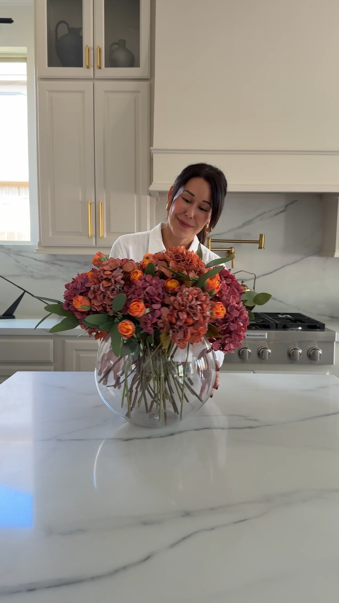 How many of each flower:
** I used what came in the bundle.
** burnt orange roses: 24 (one set)
** each hydrangea color comes in a set of 6. I use the set for each color
** the eucalyptus comes in a set of 15 and I used them all. 
Creating a beautiful Thanksgiving tablescape doesn’t have to be complicated 🍂✨ This faux flower arrangement from Amazon looks incredibly realistic, yet it’s completely artificial—making it the perfect low-maintenance centerpiece. I love that it can be reused year after year, saving both time and money while still giving that elevated, organic look we all want for holiday hosting. Whether you’re styling your dining room, setting up for Friendsgiving, or looking for a neutral fall centerpiece, this Amazon find is a timeless option for your table decor. 🌿🤍

faux flower arrangement, artificial flowers, Amazon home decor, realistic faux flowers, Thanksgiving tablescape, fall centerpiece, reusable decor, dining table styling, holiday hosting essentials, neutral fall decor.

#LTKSeasonal #LTKHome #LTKFindsUnder100