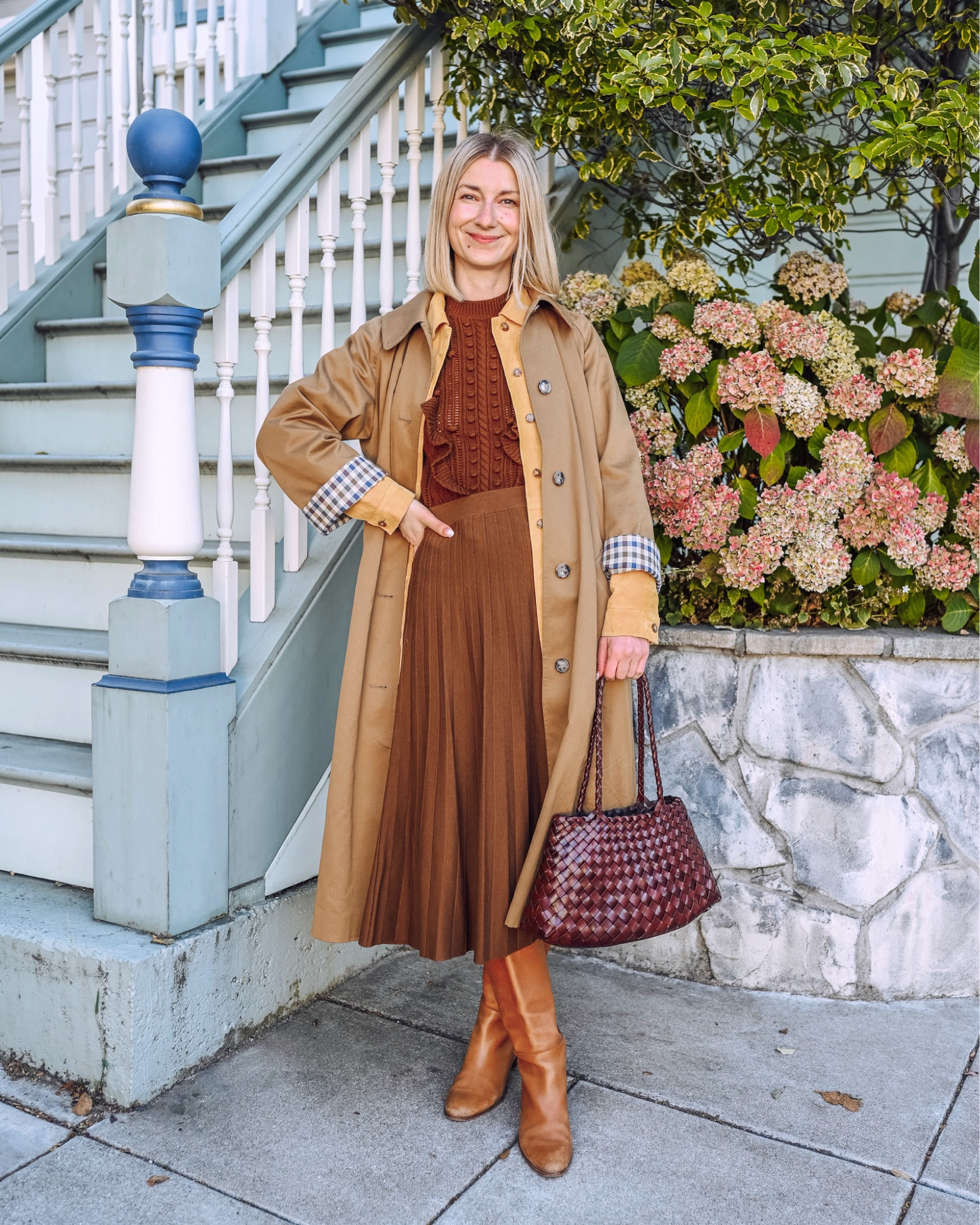 The perfect fall layers! An oversized trench coat, suede barn jacket, midi wool pleated skirt and knee high boots. Braided leather shoulder bag to finish the look. This everyday outfit is chic, sophisticated and classic. Pairing rich brown and honey tones is the key for a memorable look 