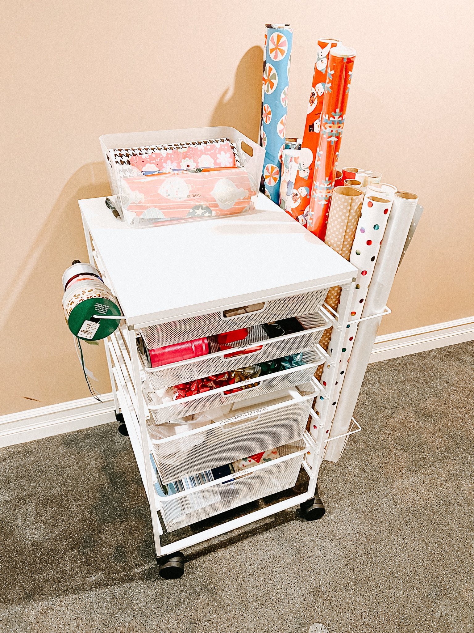 The perfect gift wrap station does exist! An organized wrapping station is just one way to make your holidays just a little less stressful. 

#LTKHoliday #LTKSeasonal #LTKhome