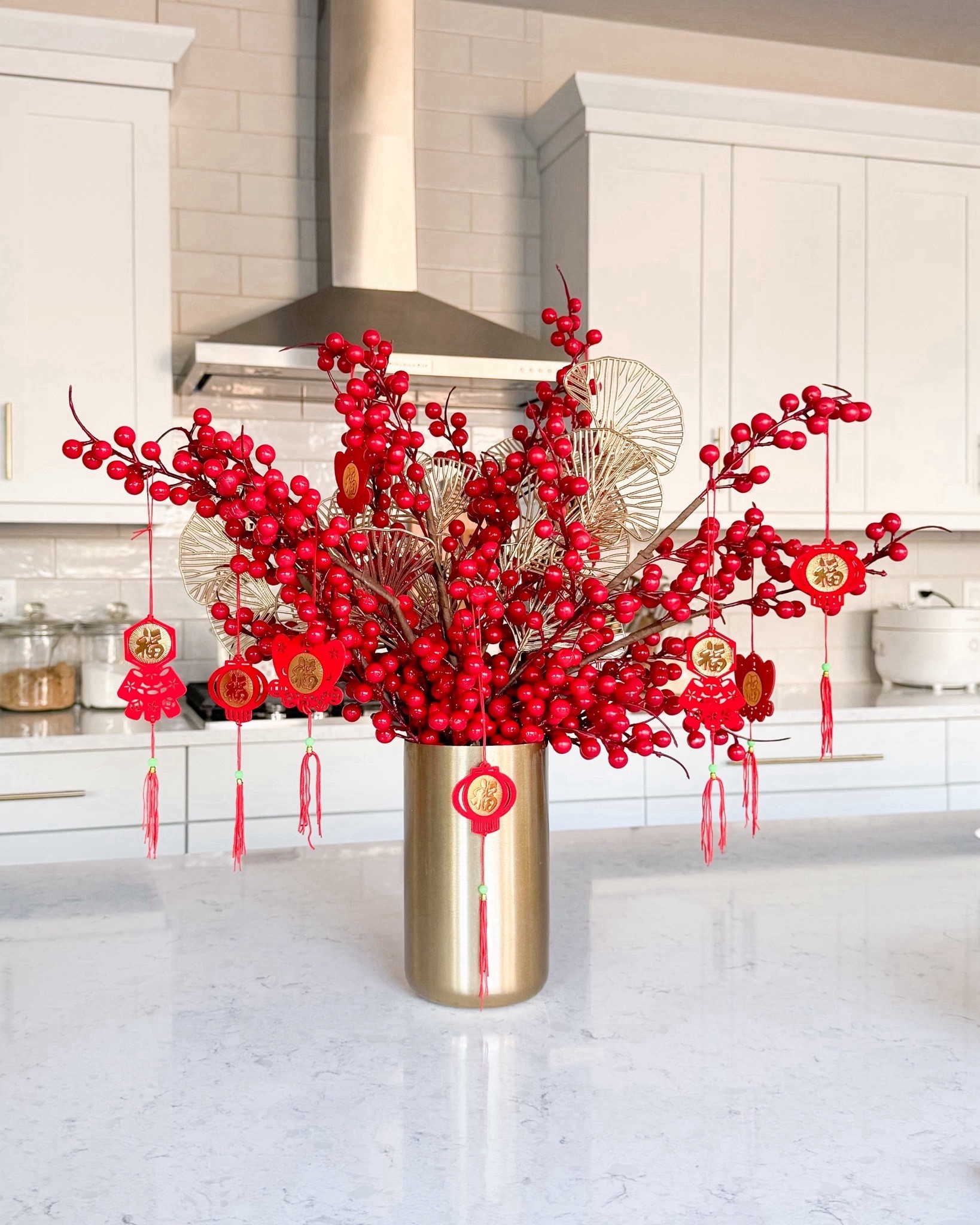 Lunar New Year decor! 
vase, artificial plants, hanging pendants 

#LTKhome #LTKMostLoved #LTKSeasonal