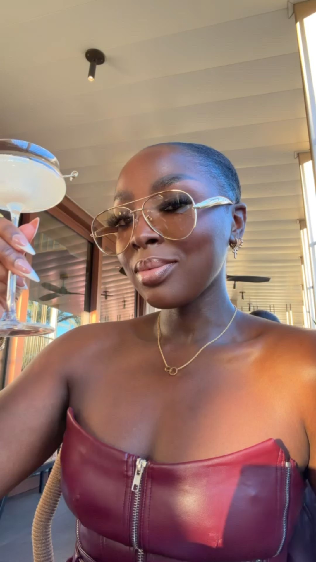 Hold your martini glass by the stem, ladies! 😉 


