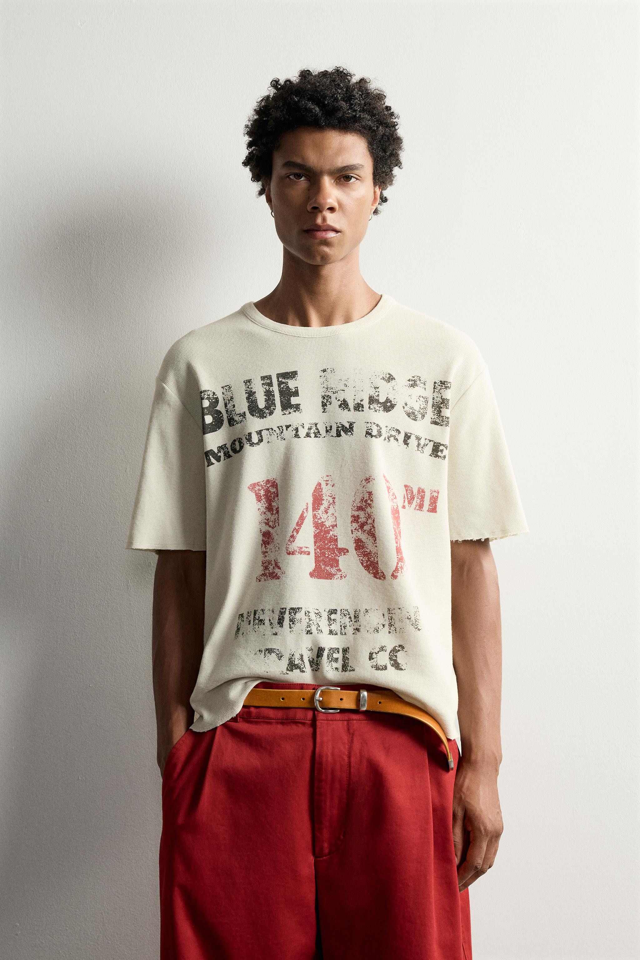 Relaxed-fit cotton knit T-shirt. Crew neck and short sleeves. Features contrasting graphic prints... | Zara US
