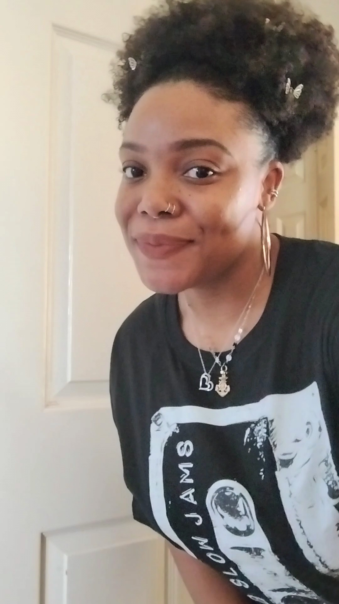 What are you guys wearing for festival season?🎶 I know the cowboy trend is popular but I think I'll go with my 90s vibe of oversized band shirts, all black fit, loaded with lots of jewelry.✨🖤 To add some festival vibes, cue the butterfly hair clips in my Afro!😄🪮👏🏾🦋

#LTKootd #LTKFestival #LTKMidsize