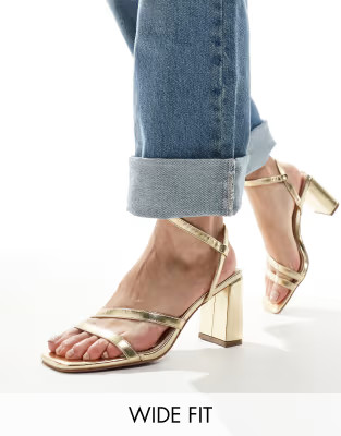 ASOS DESIGN Wide Fit Hampstead mid heeled sandals in gold | ASOS (Global)