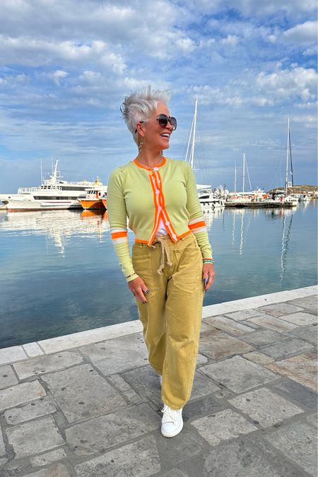 An unexpected neutral pair of jeans paired with a florescent orange trimmed cardi?! YES PLEASE! It served me well on my Greece vacation! 

#LTKover40 #LTKtravel #LTKstyletip