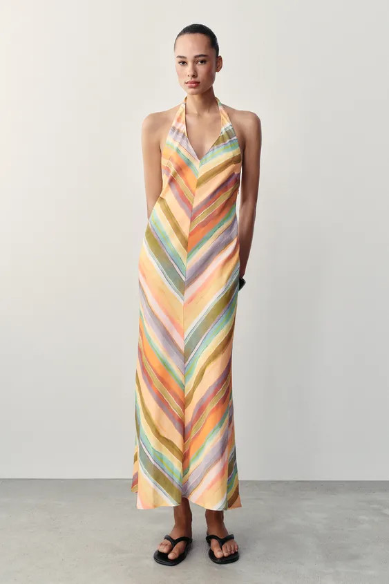 Halter neck dress with V-neckline and open back. Side hidden in-seam zip closure and back tie fas... | Zara US
