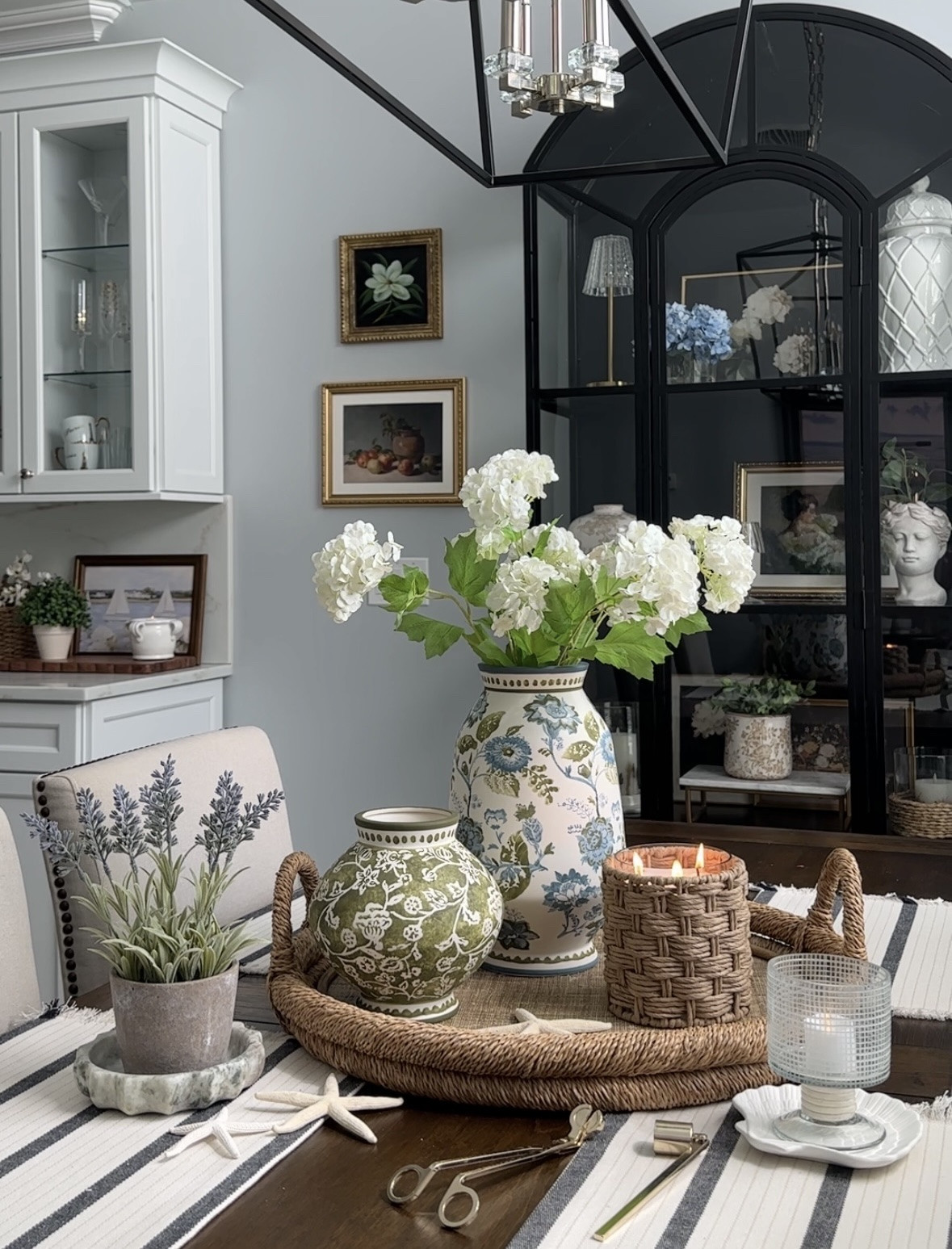Spring tray with follower favorite vases, new rattan candle, small hurricane candle on sale, coastal decor, florals, artwork, plant arrangements, display cabinet, chandelier +more @Target Pottery Barn, Amazon home.