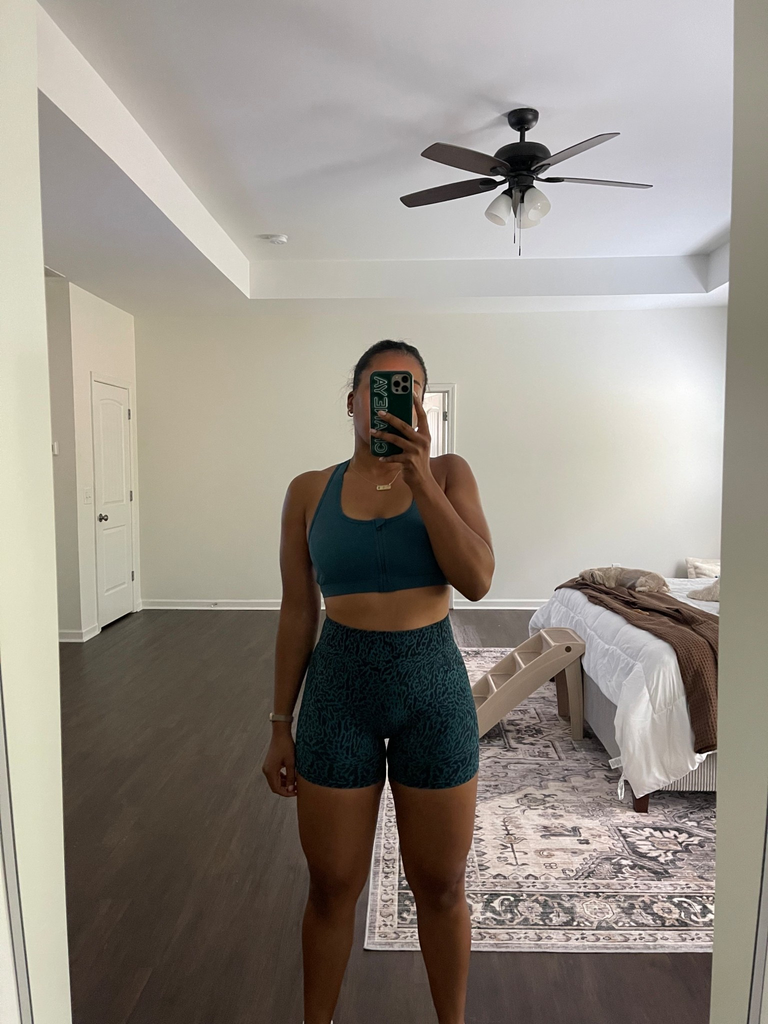 Fabletics seamless scrunch butt workout shorts and medium support sports bra. Wearing a size medium in both top and bottom.

#LTKMidsize #LTKActive