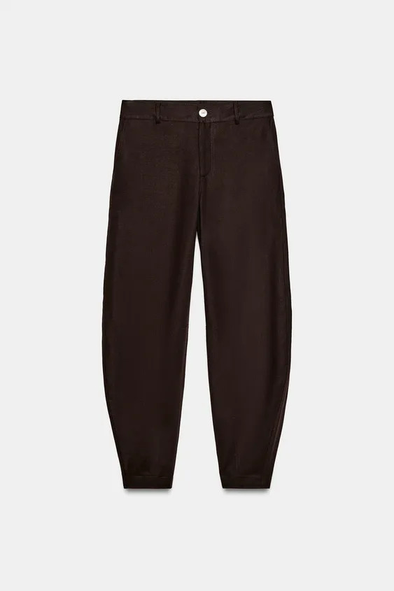 Pants made of linen. Mid-rise with front pockets and back false welt pockets. Loose leg narrowing... | Zara US