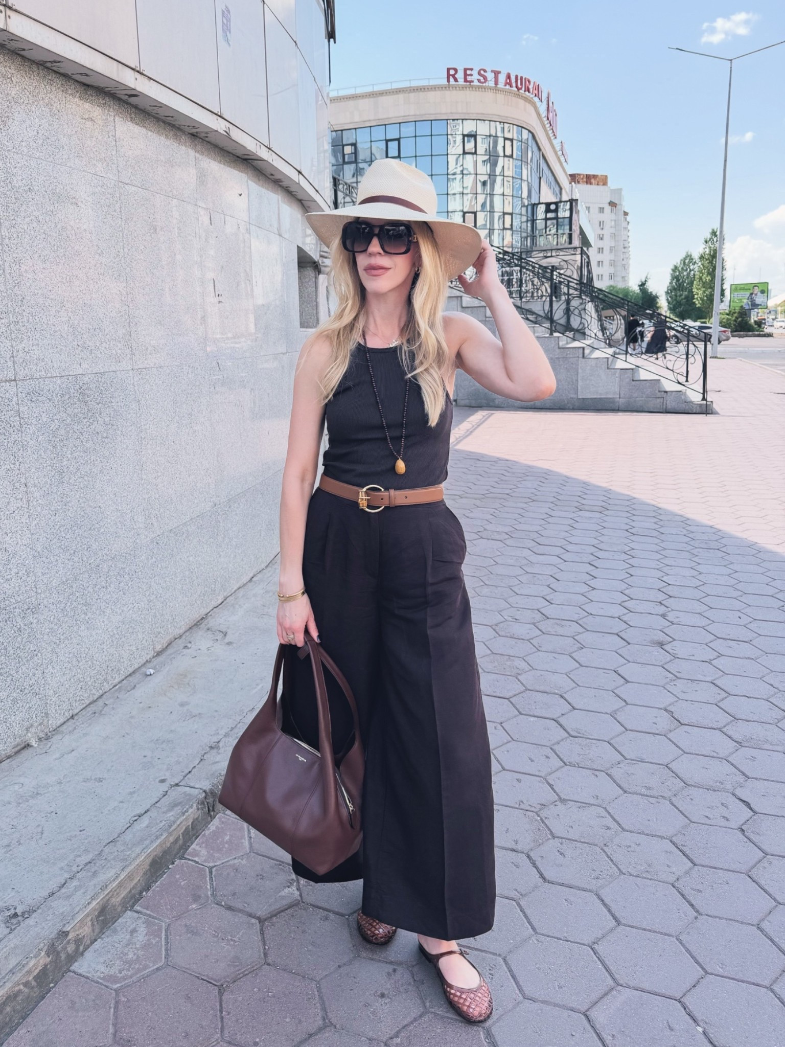 Chocolate brown is trending right into summer! 🤎 

Dark brown linen pants, jelly shoes, Le Tanneur handbag, @Janessa Leone straw hat

#LTKTravel #LTKSaleAlert #LTKOver40
