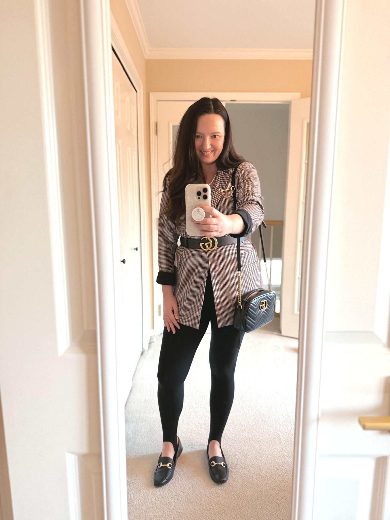 Paired comfy, chic stirrup leggings from Athleta with a long houndstooth blazer, which I belted with a Gucci belt and topped off with a super cool horsebit brooch I found at Walmart, of all places, that has major Gucci vibes! Perfect workwear outfit for a more business casual vibe.  I bought this blazer used, but linked a similar one from Amazon. Can either pair with loafers like these or pointed toe heels - both options look great with stirrup pants!