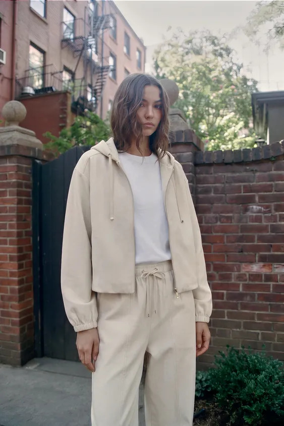 Bomber-style jacket featuring a hood with adjustable drawstrings, long sleeves with cuffs, front pockets and front zip fastening. | Zara UK