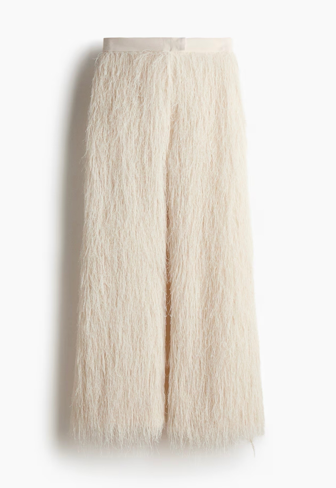 Dressy pants in woven crêpe fabric with billowing fringe at front. Decorative waistband tab at front with hook-and-bar fasteners and a concealed zipper at one side with hook-and-eye fastener. Mock back pockets, creases at back, and straight legs.

#LTKholiday #LTKpartywear #LTKcanada