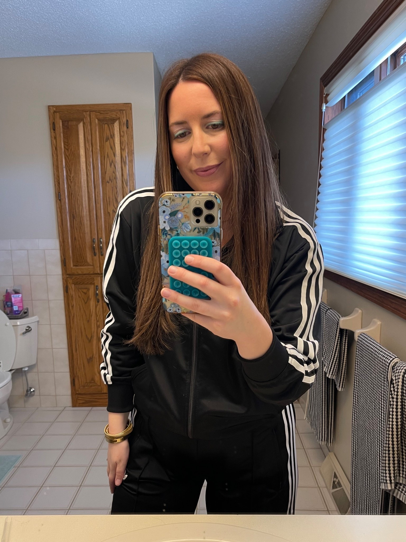 Dressed and ready for my husband’s 1980s-themed 40th birthday 💿🪩 Decided to wear a classic adidas firebird track suit, some chunky gold jewelry, and turquoise eye liner! 

#LTKParties #LTKFindsUnder100