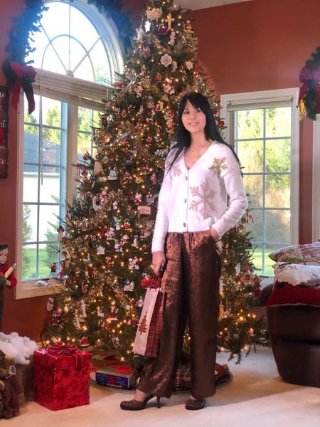 Christmas and Sparkle go hand in hand!
This soft and cozy cardigan is the perfect blend of holiday snowflake pattern and glitter for those who don’t like going overboard! I love the gold, glittery snowflake buttons!
Pairing with shimmery, loose trousers gives the sweater an extra holiday vibe of cozy elegance! These pants were from last year, but I was able to find the same and similar ones available now. 


#LTKHoliday