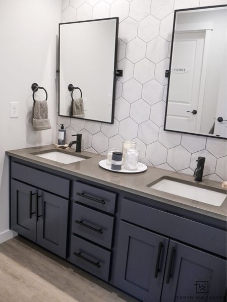 Double vanity bathroom decor with hexagon tile and black pivot mirrors 

#LTKhome