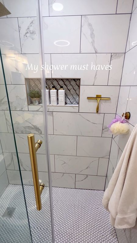 Shower must have! I love the hotel vibe and wanted my space to look and feel that way without breaking the bank! Sharing a few of my favorites! Gold decor | gold squeegee | shower shampoo soap conditioner dispenser set | gold shower towel hooks | @amazon | #amazonhomefinds 

#LTKFindsUnder50 #LTKHome #LTKSaleAlert