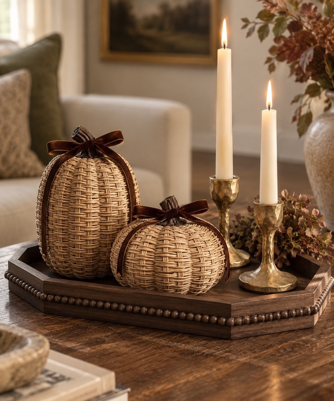 to feel like fall. 🍂🤎 The woven pumpkins with those little velvet bows are such a pretty way to bring in the season while keeping everything warm and neutral. Paired with sculptural aged-brass candle holders and that dark walnut beaded tray, the whole vignette feels collected, textured and cozy without being overly themed.

fall decor, neutral fall decor, fall home decor, Amazon fall decor, Amazon fall finds, Amazon home finds, woven pumpkins, rattan pumpkins, wicker pumpkins, neutral pumpkins, decorative pumpkins, fall pumpkin decor, pumpkin decor ideas, elegant fall decor, elevated fall decor, classy fall decor, subtle fall decor, cozy fall decor, warm fall decor, transitional fall decor, organic fall decor, natural fall decor, fall coffee table decor, fall coffee table styling, coffee table decor, coffee table styling, fall centerpiece, fall vignette, autumn decor, autumn home decor, walnut tray, decorative wood tray, coffee table tray, beaded wood tray, wood decor tray, brass candle holders, gold candle holders, taper candle holders, aged brass decor, antique brass decor, flameless taper candles, fall living room decor, fall entryway decor, fall console decor, neutral home decor, warm transitional decor, collected home decor, cozy home inspiration, seasonal decorating ideas, fall decorating ideas, Home and Behold

#LTKSeasonal #LTKHome #LTKSaleAlert