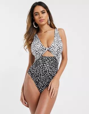 ASOS DESIGN recycled fuller bust twist front cut out swimsuit in mixed mono polka dot | ASOS (Global)