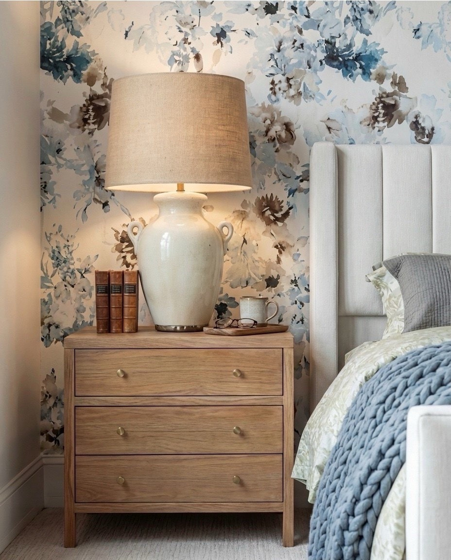 Shop the Look: Bedroom Refresh
• Blue + taupe floral wallpaper
• Cream upholstered channel-tufted bed
• Textured ceramic table lamps
• Light wood nightstands
• Mixed patterned pillows (blue ikat + green textured)
• Soft green quilt + layered bedding set
• Chunky blue-grey knit throw
• Upholstered taupe bench
• Vintage-style rug (muted blue, beige, taupe)
• Black-framed botanical artwork above the bed

#LTKSaleAlert #LTKHome