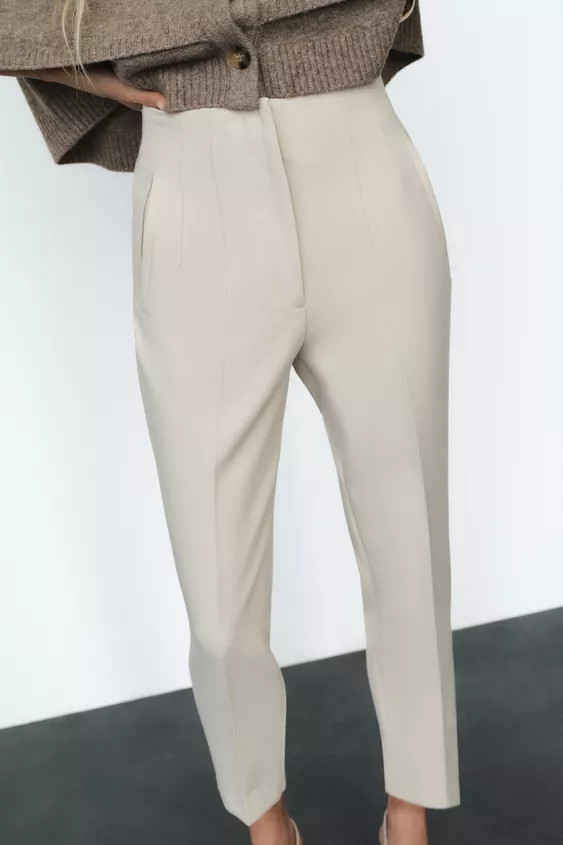 High-waist trousers with seam detail on the front and back. Front welt pockets. Front zip fly, in... | Zara UK