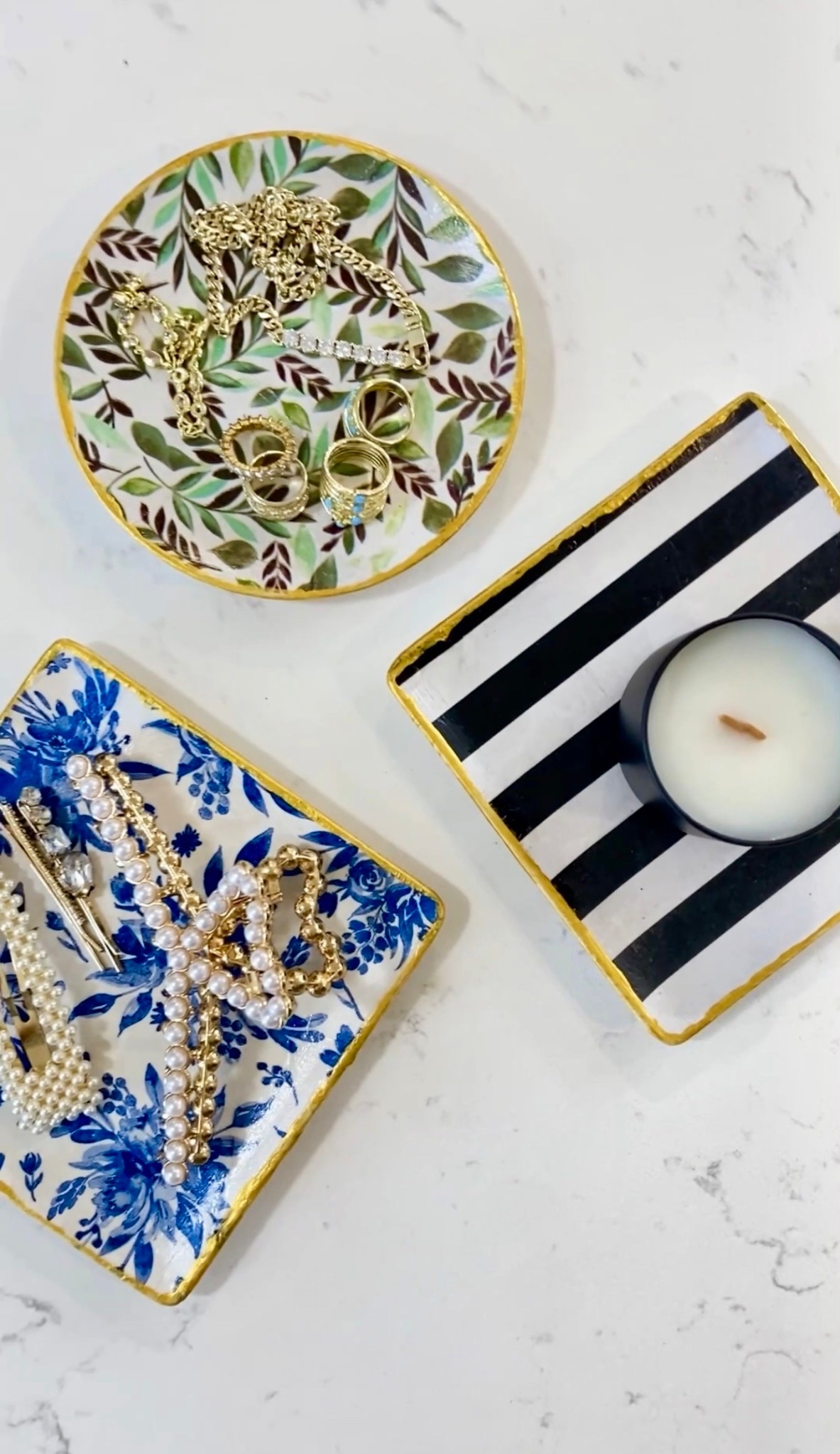 ✨ DIY gifts + easy idea for girls night in ✨ Made these cutie trinket trays for about $3 each! Picked up little plates from the craft section (at dollar tree!!!) and added my favorite tissue paper prints for a pretty, personalized ring dishes. 

Everything you’ll need: 
✨ Unfinished ceramic plate 
✨ Tissue paper or paper napkins 
✨ Mod Podge (I used ‘crystal clear’) 
✨ Gold paint 
✨ Decoupage brushes 

These make for an easy DIY gift idea, so easy to personalize for each friend, or an adorable girls night in craft 🎨✨ 


- plaid crafts 
- diy gifts 
- holiday gift guide 
- craft night 
- affordable gifts 

#plaidcrafts @plaidcrafts / #modpodgecrafts #diygifts #plaidcreators #diycrafts #bridesmaidgifts #craftnight #holidaycrafts #ltkseasonal #ltkholiday #12daysofcraftmas / 


#LTKGiftGuide #LTKHoliday #LTKHome