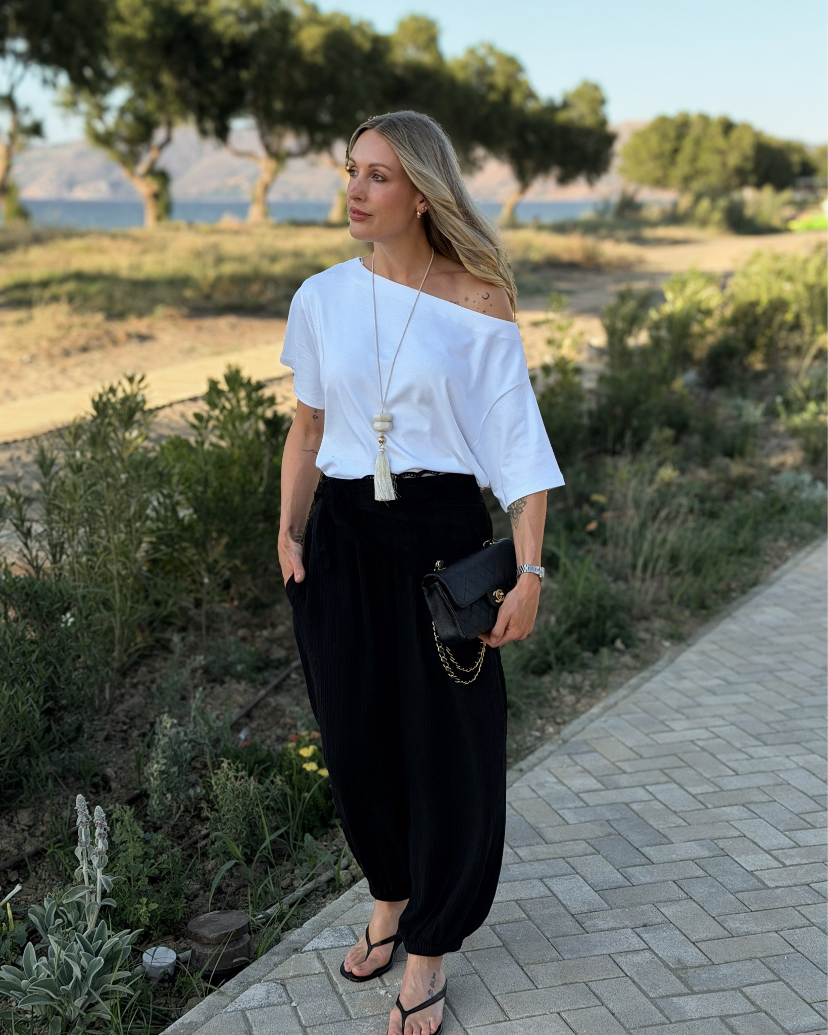 Monochrome holiday outfits summer 2026 in Greece 🇬🇷 

As you can see styling balloon trousers was my favourite on holiday!

#LTKuk #LTKsummer
