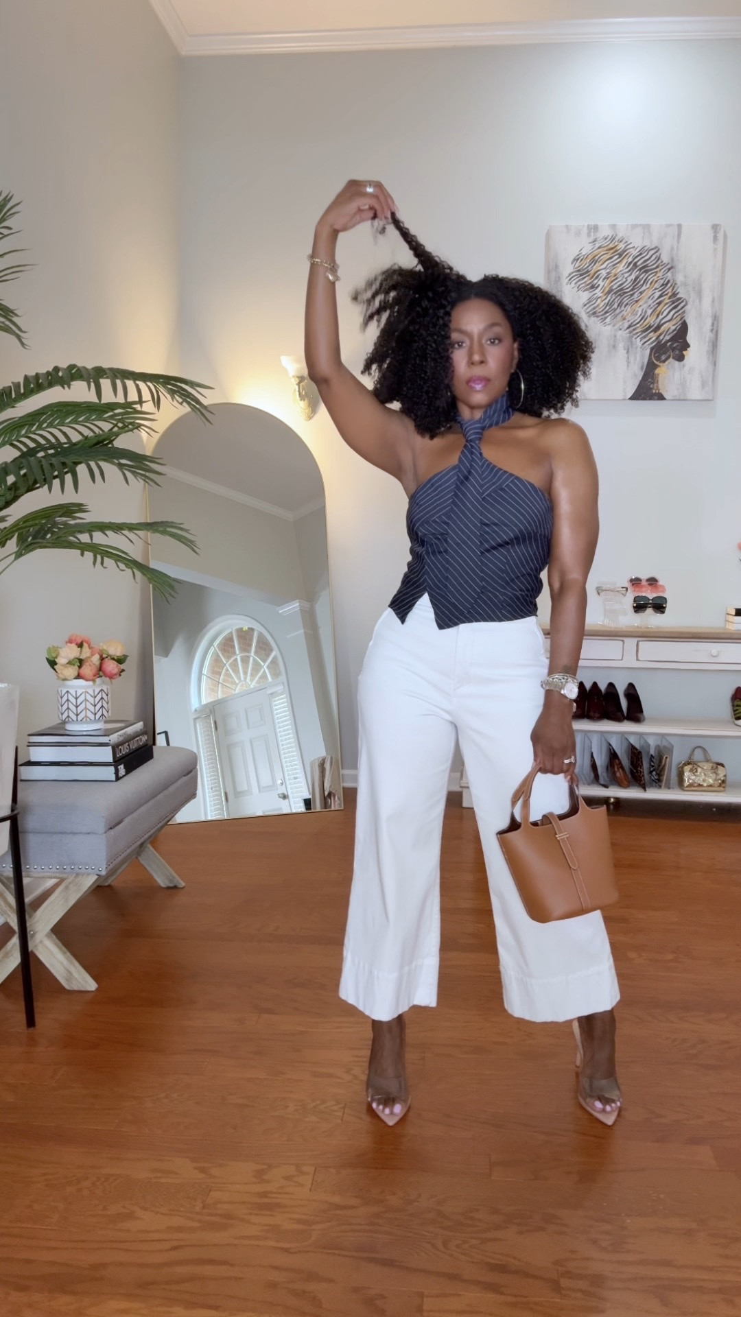 This Amazon tie halter top is the moment. 👏🏾

The tailored pinstripe design gives menswear-inspired sophistication, while the halter neckline keeps it feminine and unexpected. It’s one of those pieces that instantly elevates everything you pair it with.

I styled it with crisp white pants and cognac accessories for a chic summer look.  Save this look for brunch, date night, girls’ night, or whenever you feel like being the best-dressed woman in the room. ✨

5’4” | 155 lbs for reference

Tie Halter - Medium
Spanx Wide Leg Capris - Medium
Clear Heels - 9

✨ SHOP my look ✨

This top is definitely staying in rotation all season long.

#AmazonFashion #PinstripeTop #FashionOver50 #SummerStyle #fyp #MenswearInspired

#LTKgrwm #LTKootd #LTKOver40