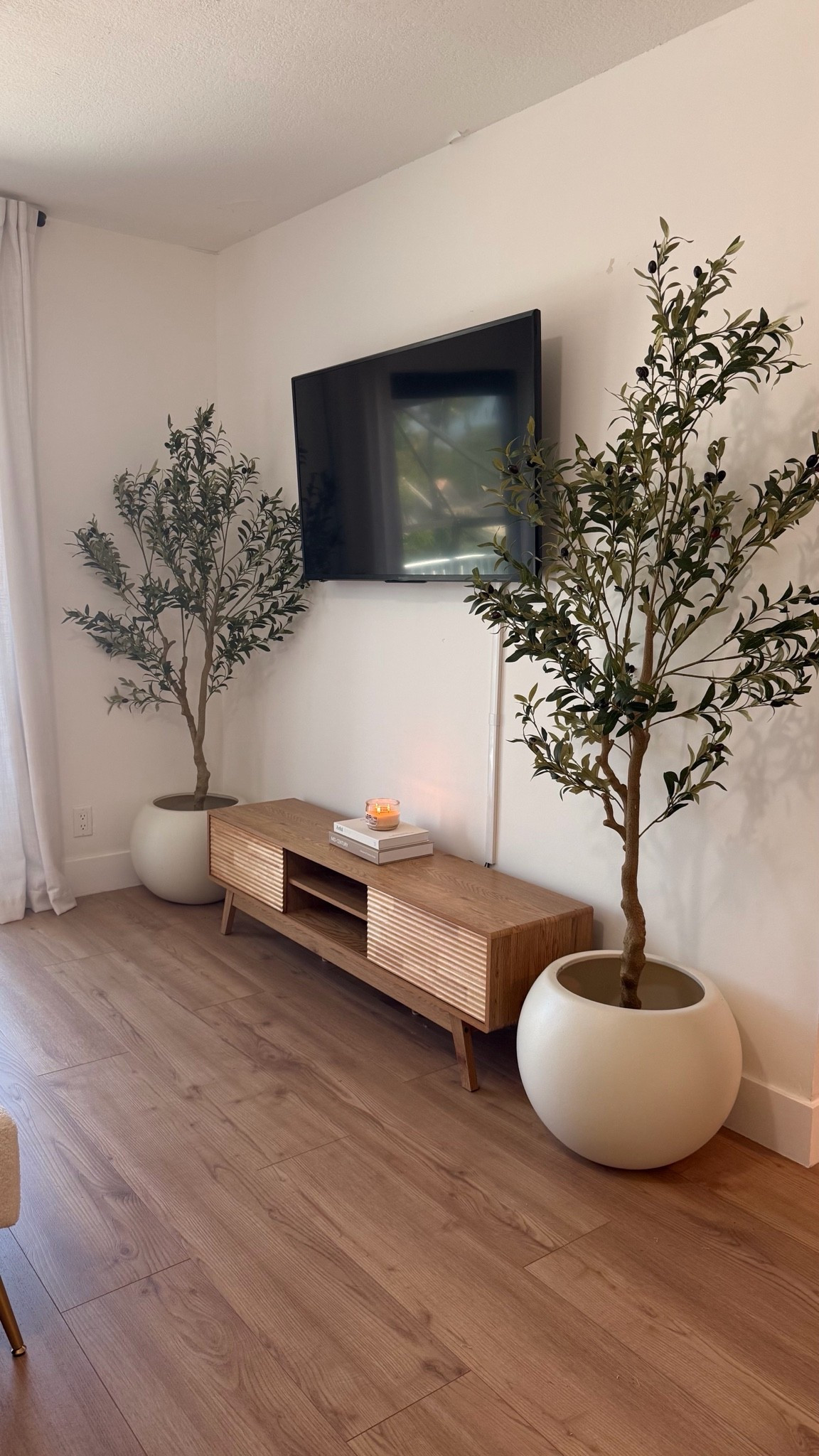 🏡 I’m obsessed with this living room setup! The fluted TV stand, oversized olive trees, and neutral tones create such a clean, elevated look that feels straight out of a home decor magazine. If you love cozy, modern spaces, these finds are definitely worth checking out.

🌿 Me encantó cómo quedó este espacio. Los tonos neutros, el mueble de TV y los árboles decorativos hacen que la sala se vea elegante, acogedora y mucho más sofisticada sin necesidad de una remodelación completa.

Shop the links below.

Follow me on Instagram and YouTube @kirasfashionfinds

#LTKHome #LTKvlog