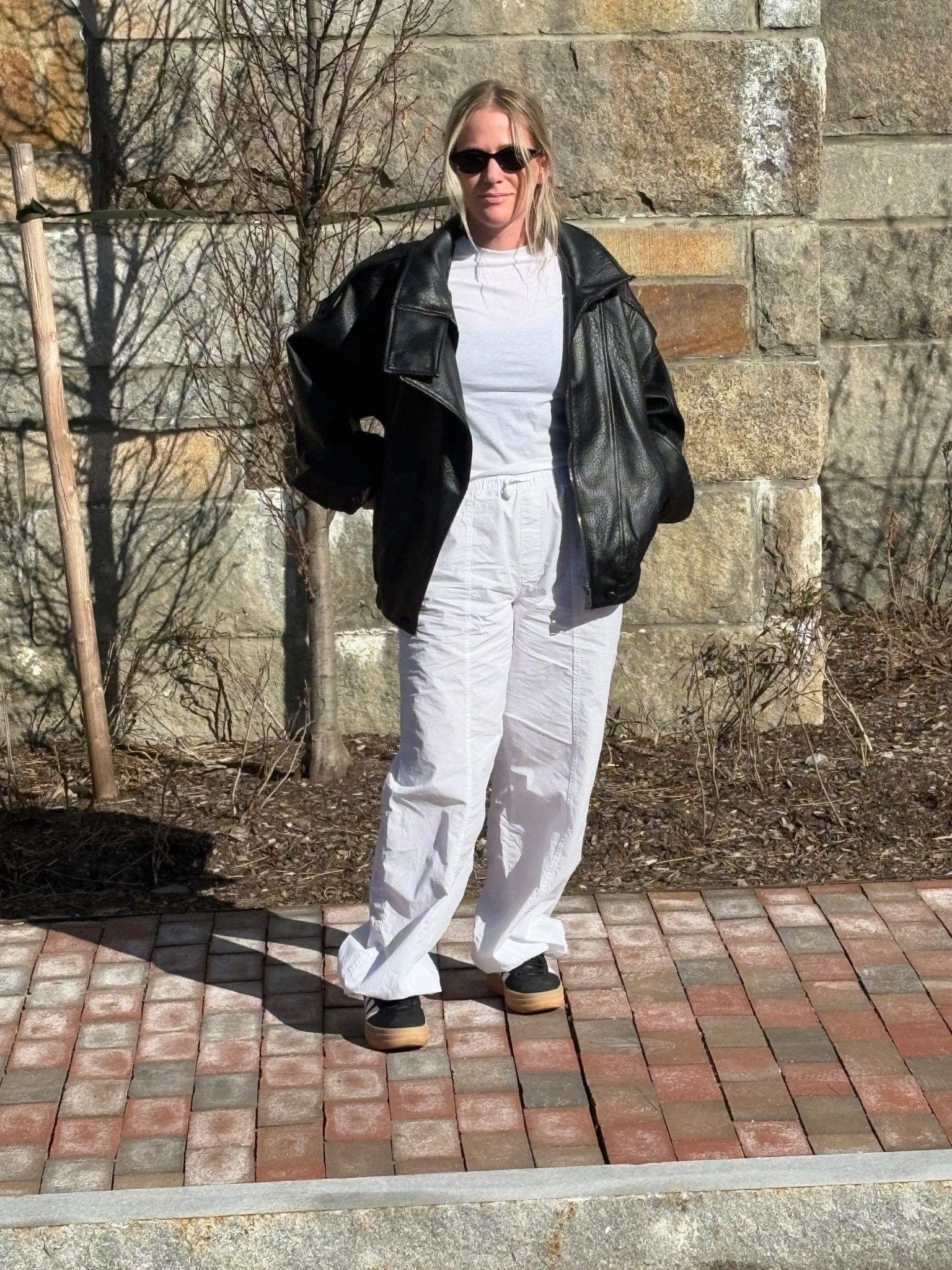 White on white look 
Parachute balloon pants 
Leather bomber jacket 
White tee 
Black oval sunglasses 
Adidas black sneakers 

#LTKdayinmylife #LTKSaleAlert #LTKootd