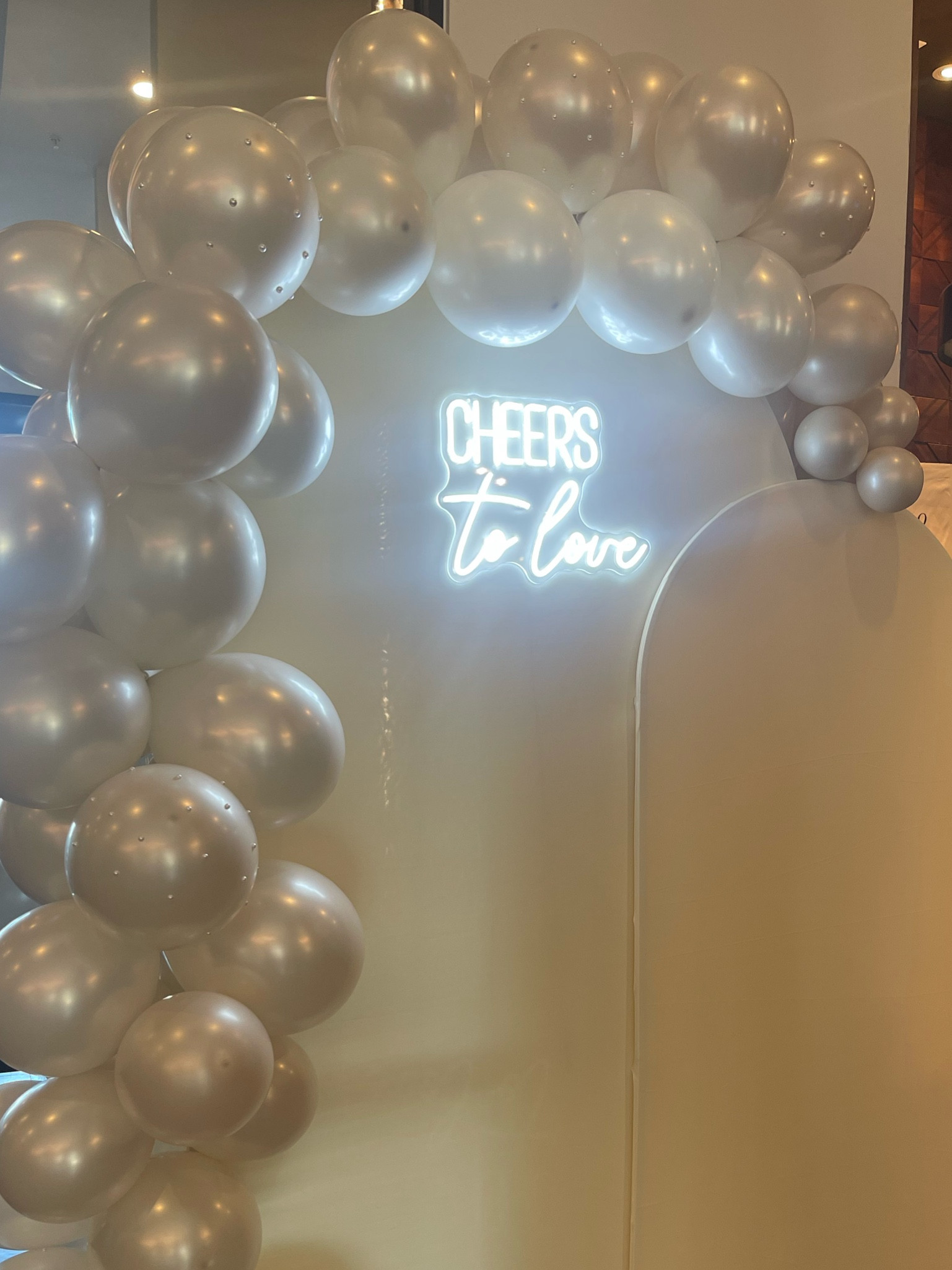 Engagement party decor!! everything is from Amazon 🥰 I used these double lined pearl balloons and put sticky pearls on them to add some flava! Neon sign is under $30 too! Also love that you can get different color arch covers for different events! I went with beige!

#LTKFindsUnder100 #LTKWedding