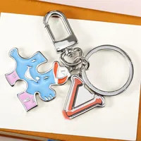 Save Big on Bulk Leather Keyrings Leather Round Keychains Designer Key Chains Men Women Couple Po... | DHGate