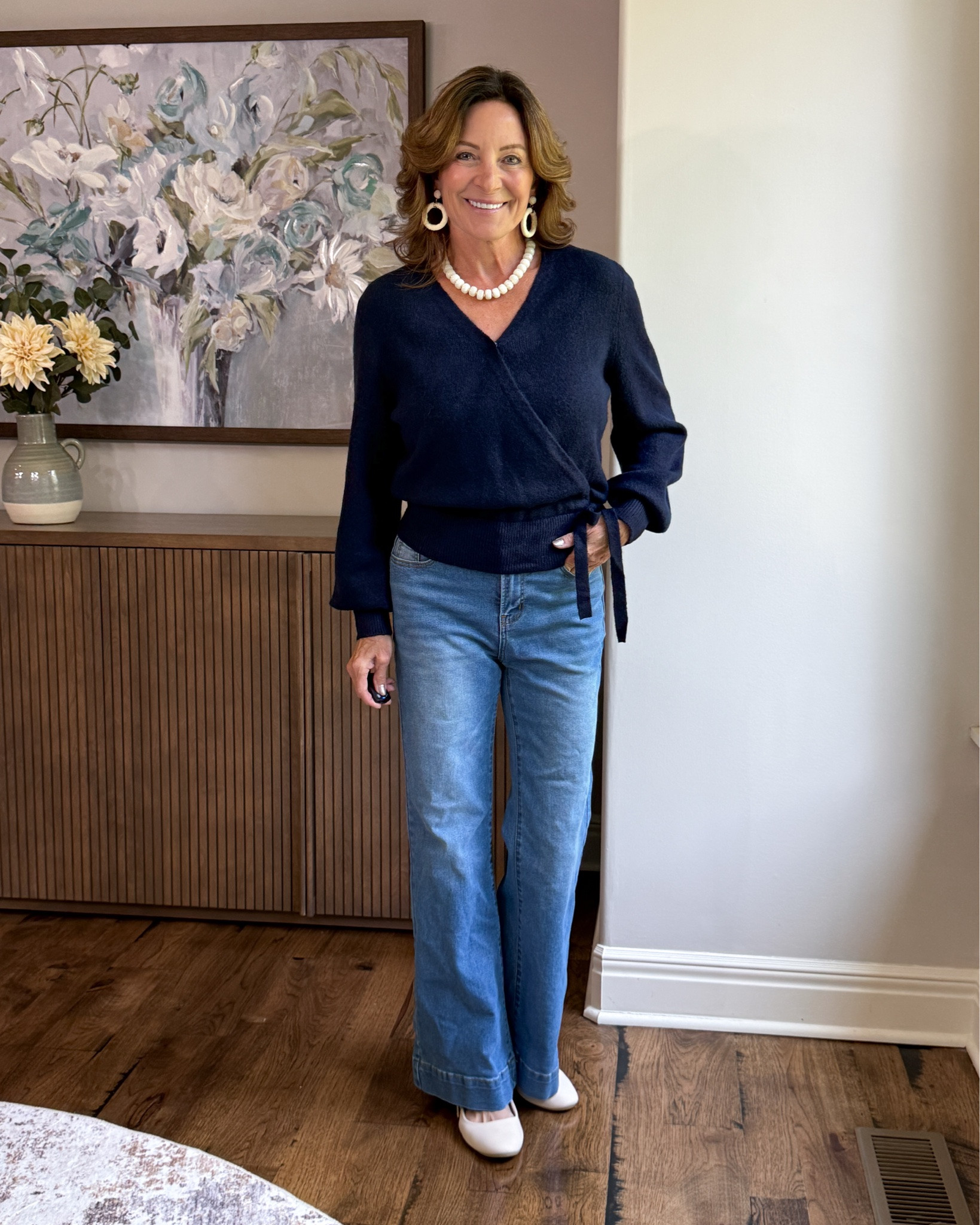 How to Style Wide-Leg Jeans for Fall

A wrap sweater is an easy way to give wide-leg jeans a little more shape and definition. The navy keeps the look classic, while white flats and accessories brighten everything up. Comfortable enough for everyday, but still feels pulled together.

#over50style #falloutfit #widelegjeans #sweaterstyle #casualchic