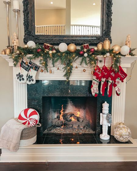Our 2023 Christmas mantle! Went with a nutcracker /little drummer boy theme for the entire living room. Love this cascading garland, hoping they restock but linking the exact and similar ones! Linking all the exact nutcrackers and gold bells! 

Christmas decorations. Christmas decor. Fireplace decor. Christmas fireplace. Christmas mantle. Cozy home decor. 

#LTKHoliday #LTKGiftGuide #LTKSeasonal