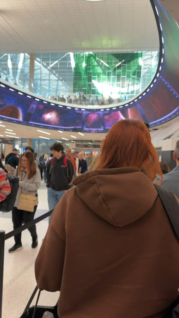 This is the line on the ground floor and I had no clue that it leads  upstairs where the line there is even longer. Anyway, I love wearing these sneakers to travel because no matter how dirty they get, I just throw them in the washer when I get home with some OXY CLEAN and they’re as good as new! 

#LTKTravel