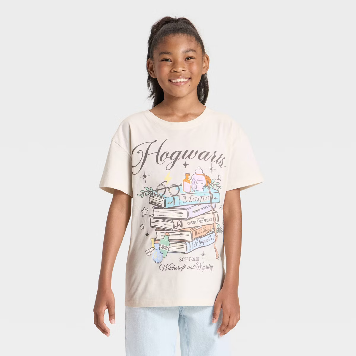 Girls' Hogwarts School of Witchcraft and Wizardry Short Sleeve Oversized Graphic T-Shirt - Cream | Target