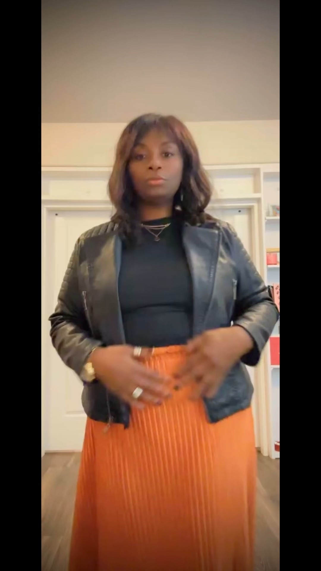 Create this cute comfortable look choose  a orange pleated skirt , black motorcycle jacket and black shirt accented with gold jewelry and
Black pumps #fall-fashion fall looks 

#LTKFallSale #LTKSeasonal #LTKFindsUnder100