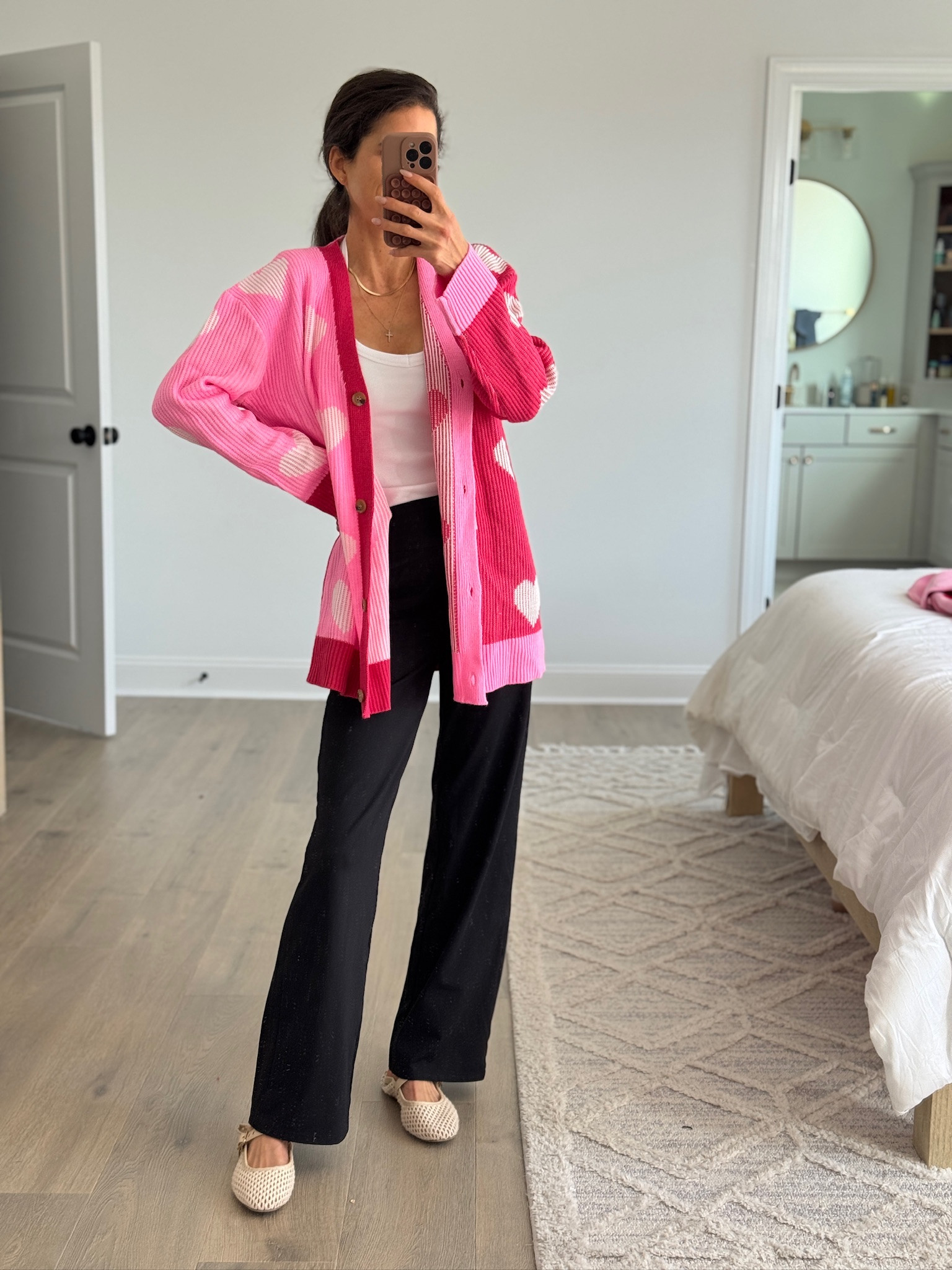 Fun pop-of-color layer that instantly elevates a simple outfit. Oversized knit cardigan with a relaxed fit, styled over a fitted tank and wide-leg pants for an easy, comfortable look. Perfect for everyday wear when you want something cozy but still eye-catching. A great statement piece to mix into a neutral wardrobe.

#LTKootd #LTKSeasonal #LTKFindsUnder50