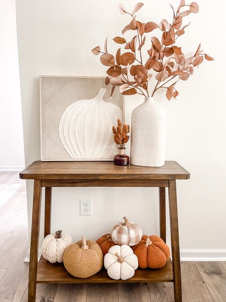 Restyled my console table with this neutral pumpkin wall art that’s just so special! I added all of my plush pumpkins to the bottom and rust colored stems to my vase. Fall decor. Fall styling. Fall decorating ideas  

#LTKSeasonal #LTKsalealert #LTKhome