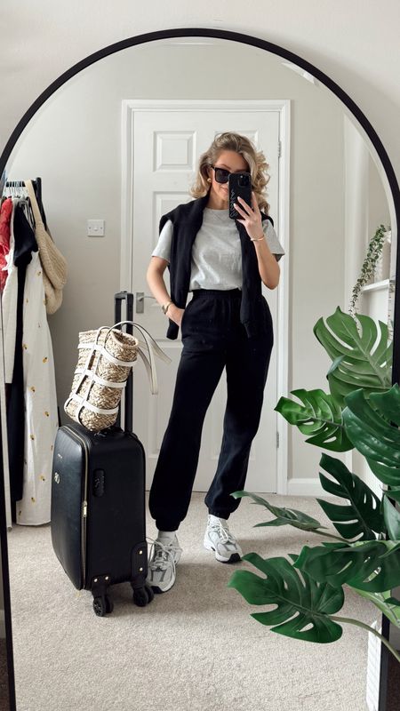 Airport outfit, travel outfit, black sweatshirt, black joggers, new balance, grey tshirt, black sunglasses, cabin case, basket bag

#LTKeurope #LTKuk #LTKtravel
