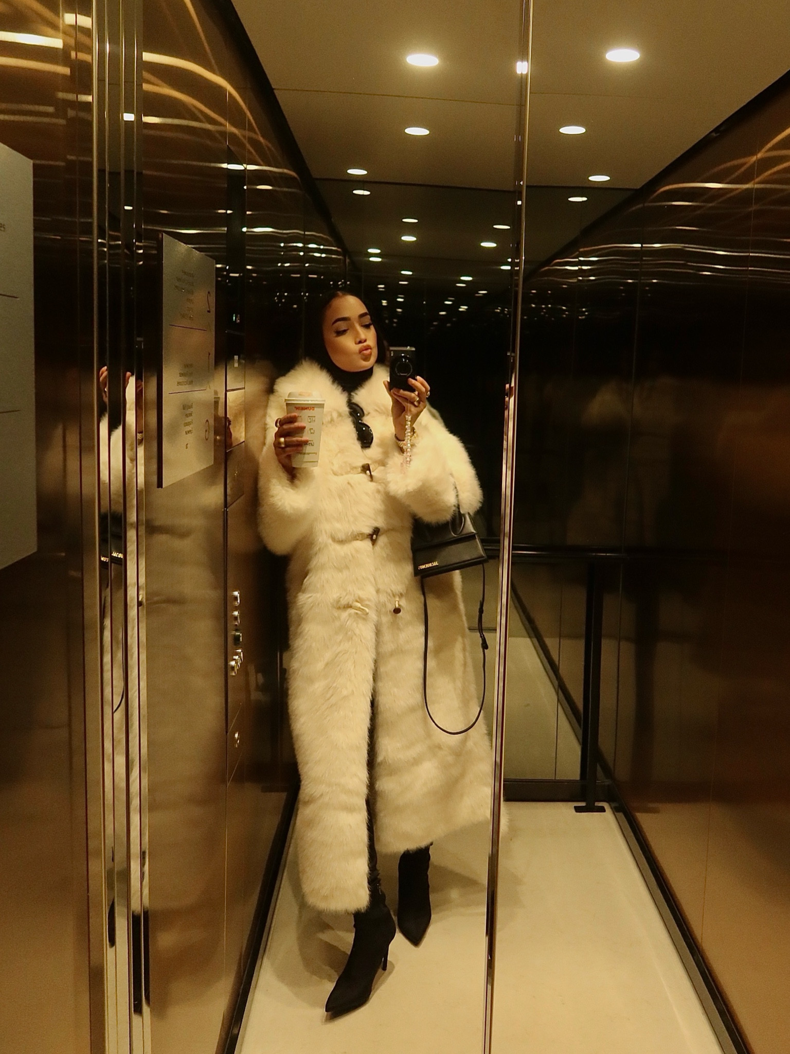 Modest winter fashion, modest winter outfit, fur coat, fur season, fur coat style, over the knee boots, thigh high boots, jacquemus bag, Versace sunglasses, cream fur coat, white fur coat.

#LTKuk #LTKwinter #LTKmodest