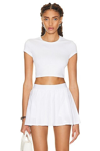 Alo Soft Crop Finesse Short Sleeve Top in White - White. Size L (also in S, XS). | FWRD 