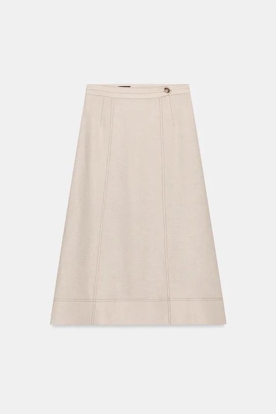 Midi skirt made of linen. Contrast topstitching detail. Front wrap closure with buttons. | Zara US