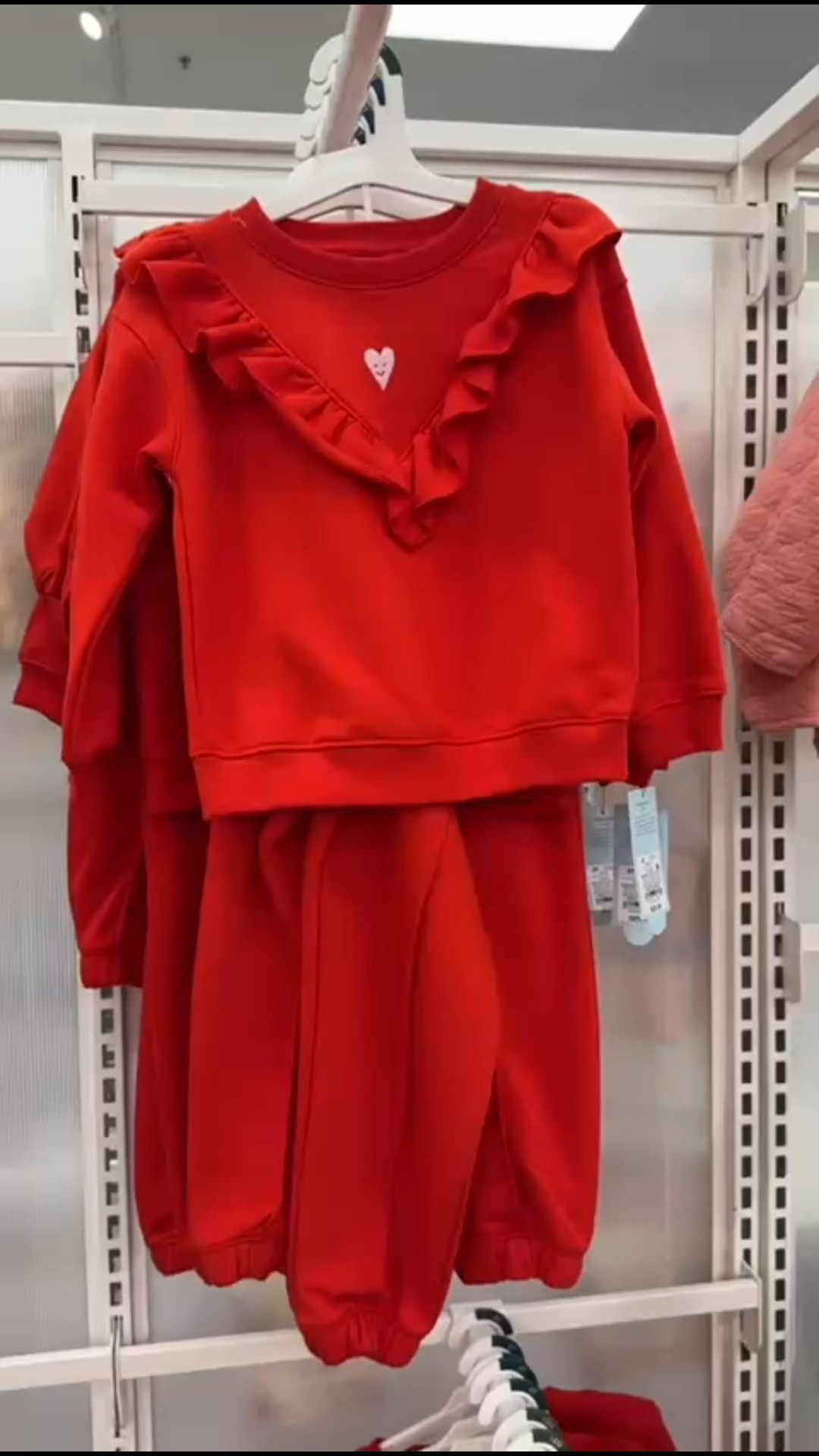 An adorable toddler lounge set featuring a soft red sweatshirt with ruffle trim and a sweet heart detail, paired with matching comfy jogger pants.

#LTKBaby