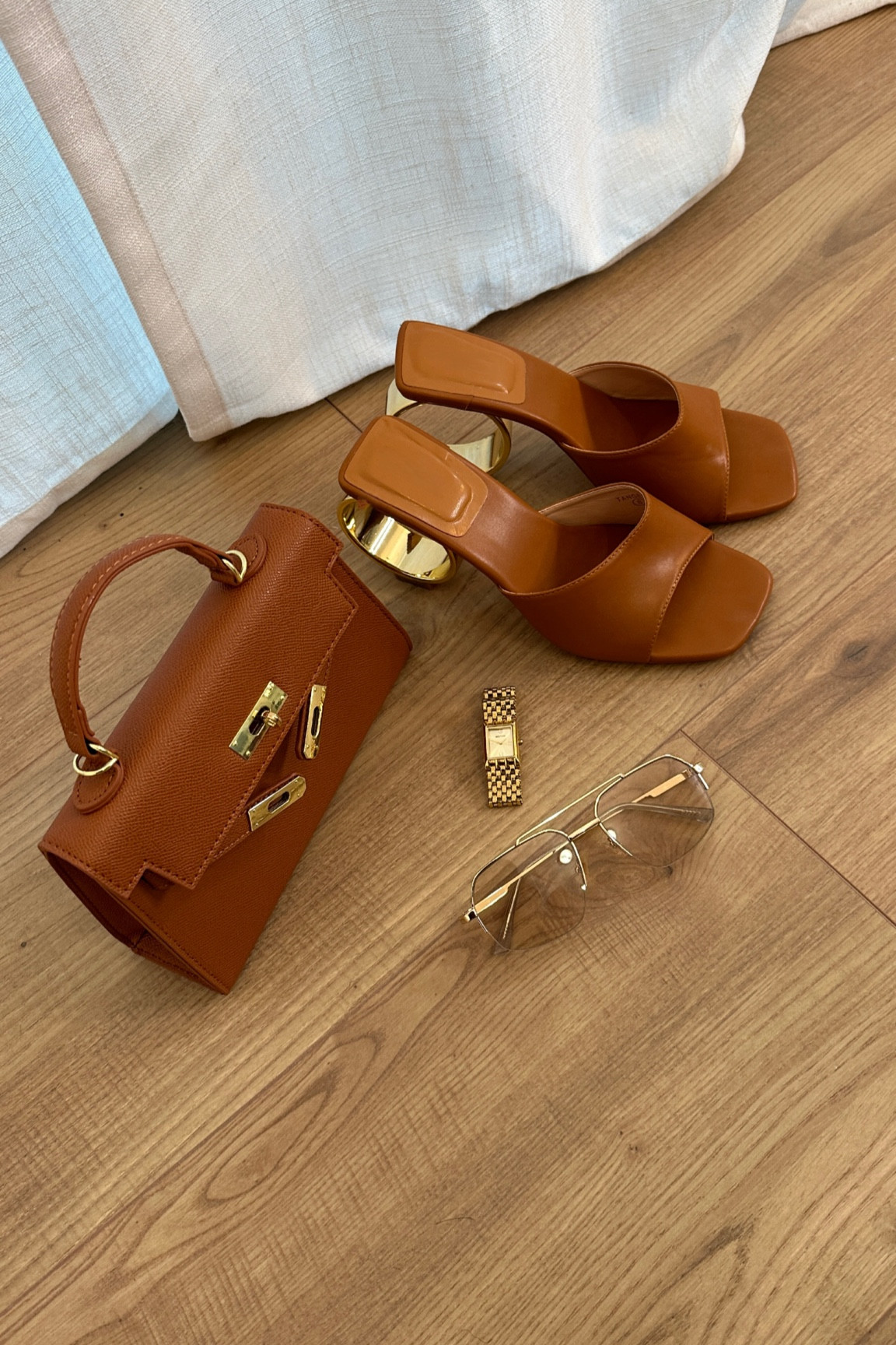 Camel brown and gold shop these items 



#LTKWatchNow #LTKItBag #LTKShoeCrush